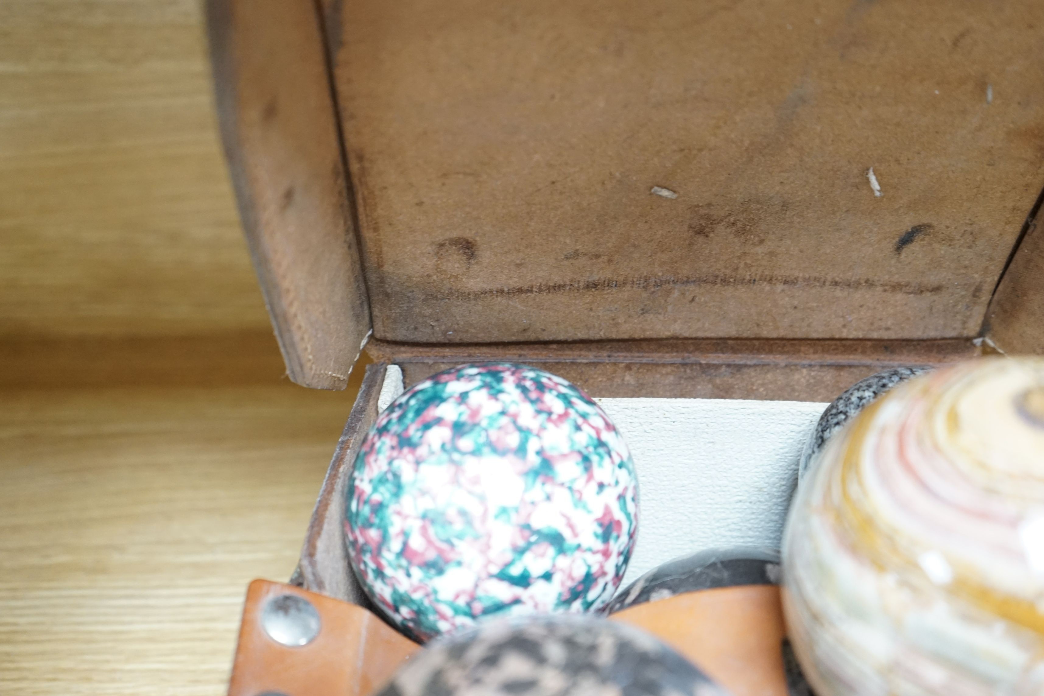 A collection of polished semi-precious stone eggs and balls